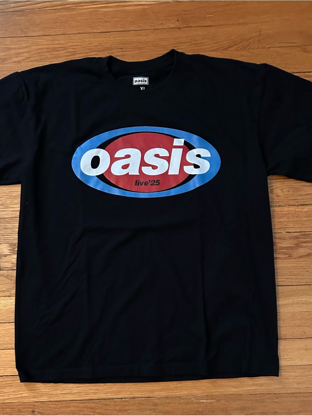 Oasis Black Tee with Red & Blue Oval Logo